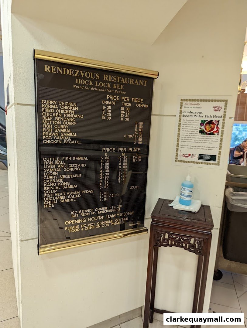 A menu board for Rendezvous Restaurant Hock Lock Kee, featuring Nasi Padang dishes and prices.
