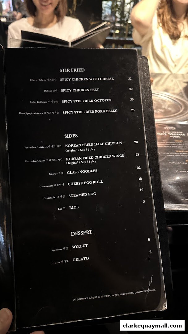 A menu from Hanjip Korean Grill House featuring stir-fried dishes, sides, and desserts.