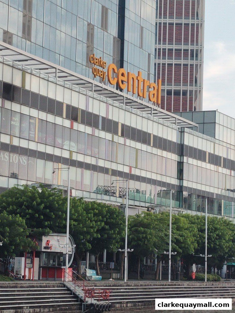 The Central building with 'Clarke Quay Central' signage and trees in front.