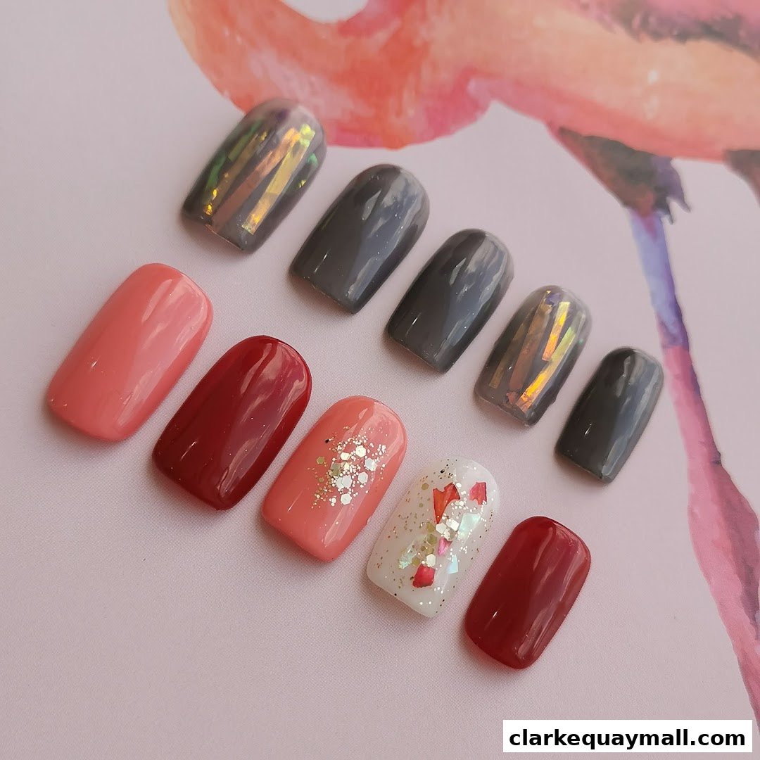 A collection of beautifully designed nail art samples in various colors and finishes.