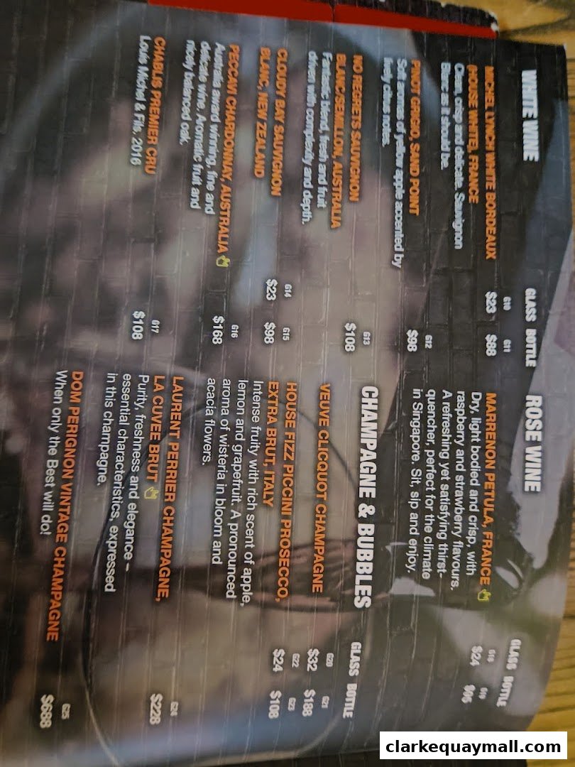 A menu featuring white wine, rosé wine, and champagne & bubbles with prices.