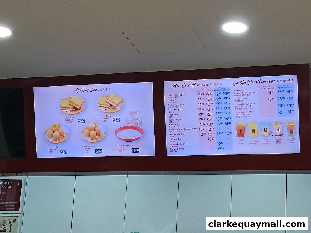 A digital menu board displaying food and beverage options from Ya Kun Kaya Toast.