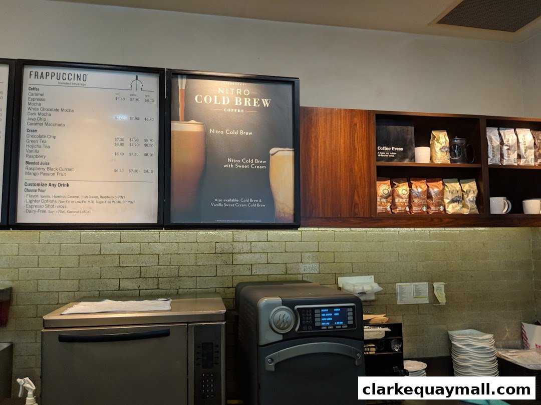 A Starbucks menu board displaying Frappuccinos and Nitro Cold Brew.