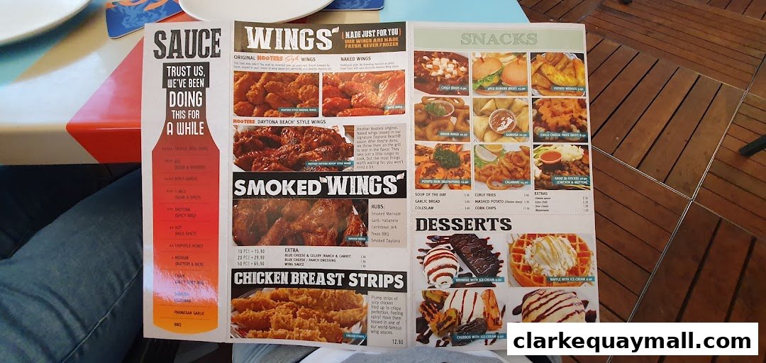 A Hooters menu featuring wings, snacks, and desserts with enticing images.