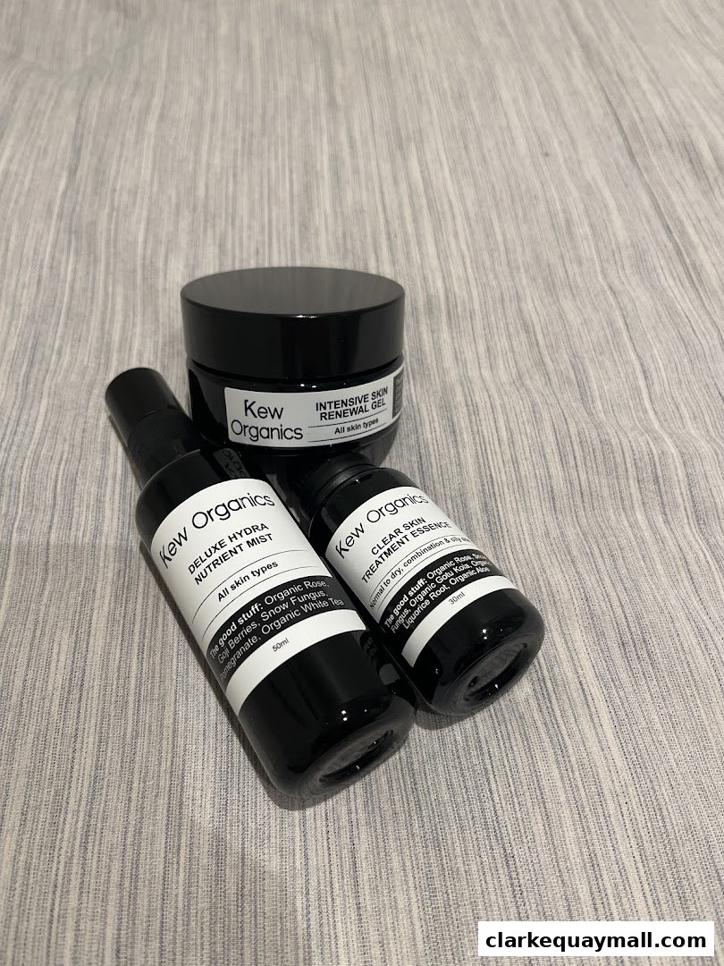 Three Kew Organics skincare products: a renewal gel, a nutrient mist, and a treatment essence.