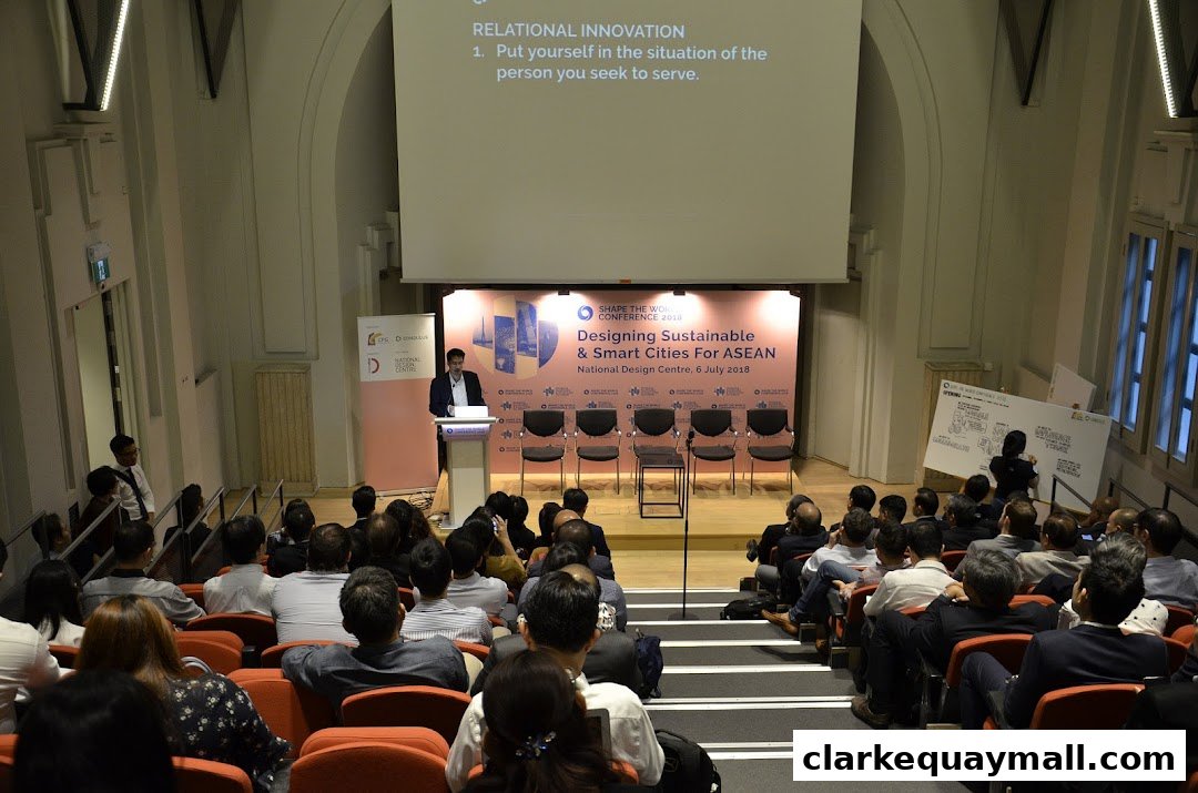A speaker presents at a conference about sustainable and smart cities for ASEAN.