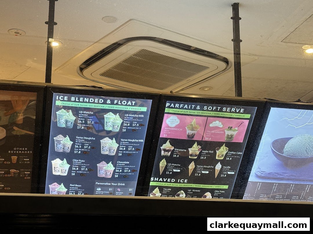 A menu board displaying various ice blended, float, parfait, and soft serve desserts.