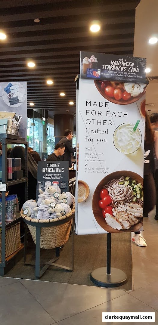Starbucks store display featuring Halloween promotions and merchandise.