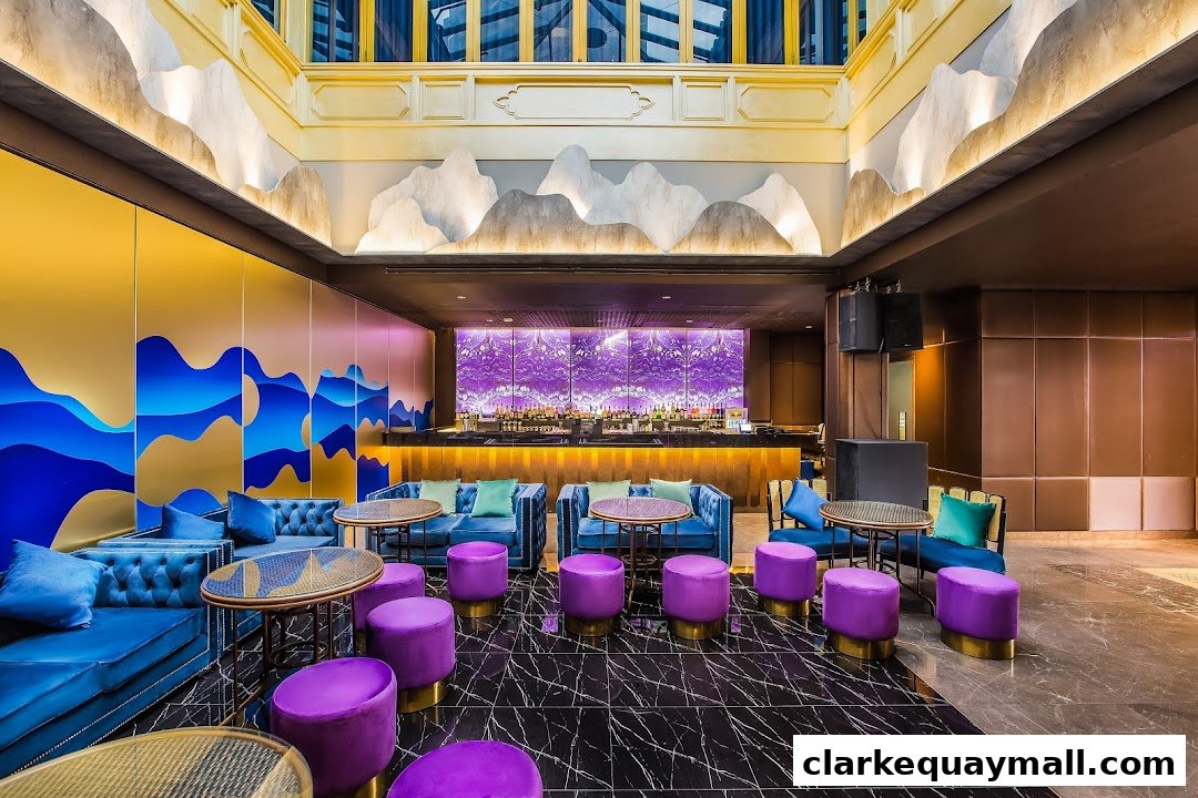 Luxurious bar interior with plush blue seating, purple ottomans, and a vibrant purple backlit bar.