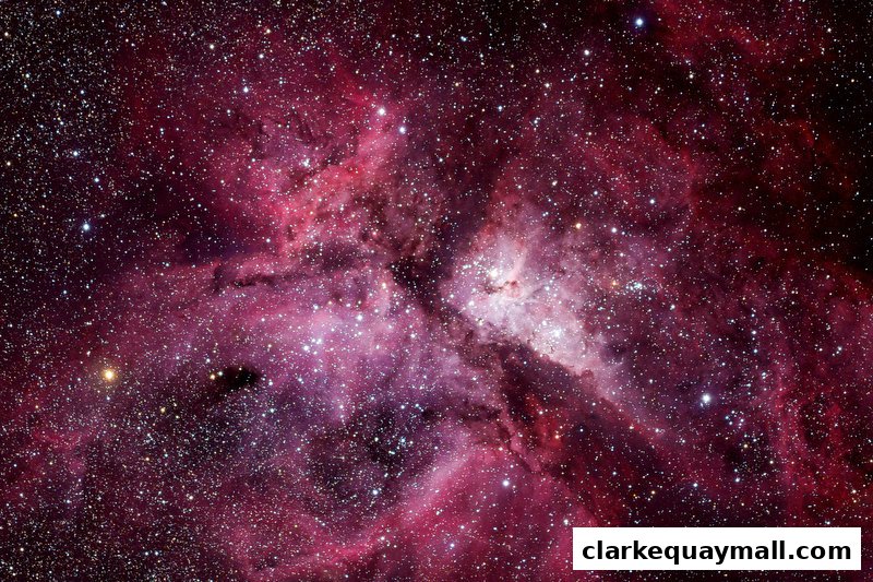 A stunning view of a vibrant pink and purple nebula filled with countless stars.