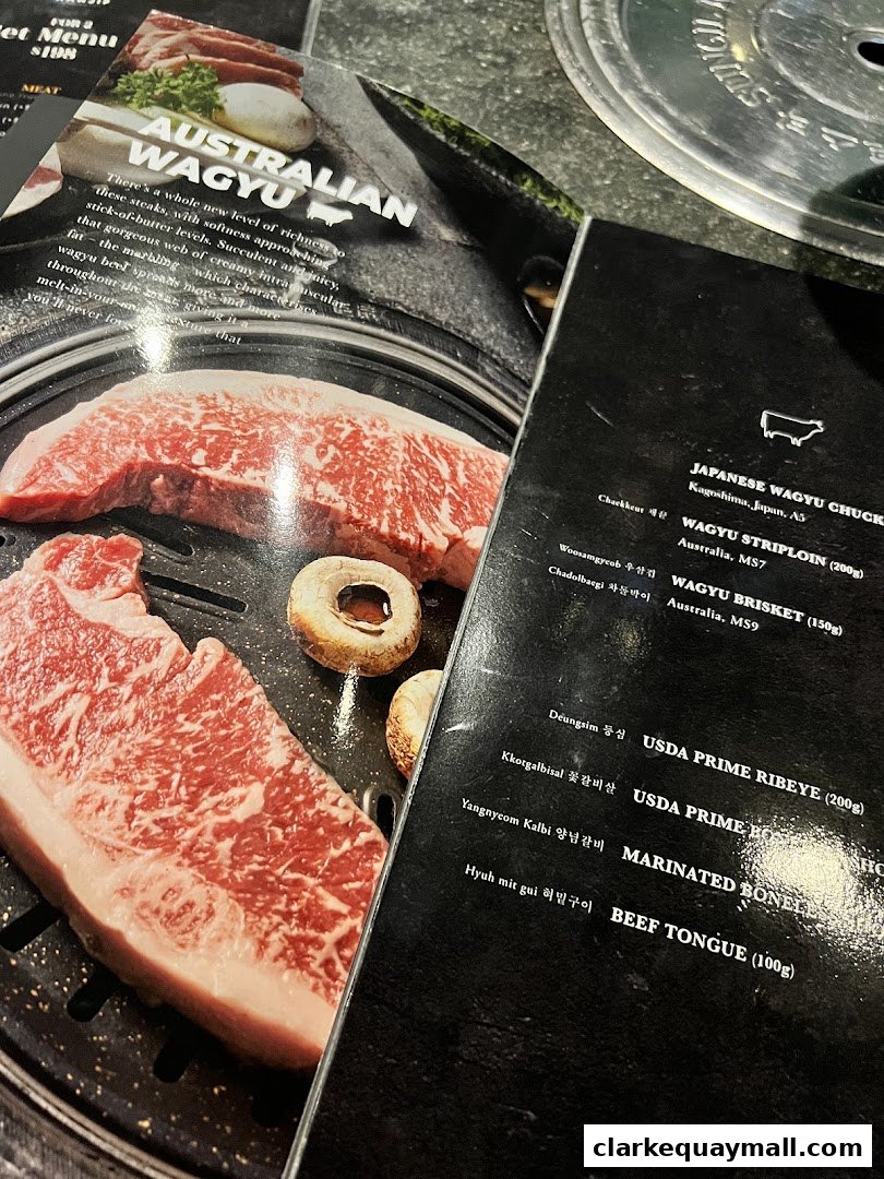 A close-up of a menu featuring premium Australian Wagyu beef and other meat dishes.