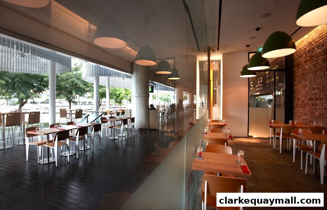 Interior view of a modern restaurant with tables, chairs, and exposed brick walls.