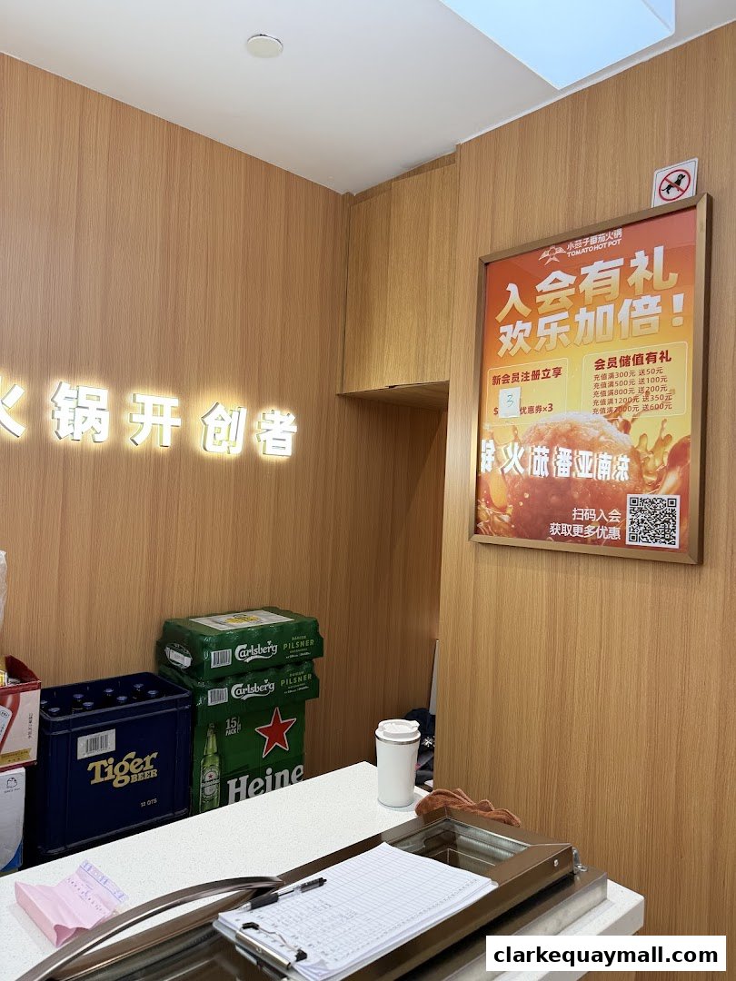 Interior shot of a restaurant with a promotional poster and stacks of beer crates.