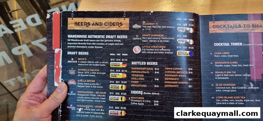 A menu featuring a wide selection of beers, ciders, and cocktails with prices.
