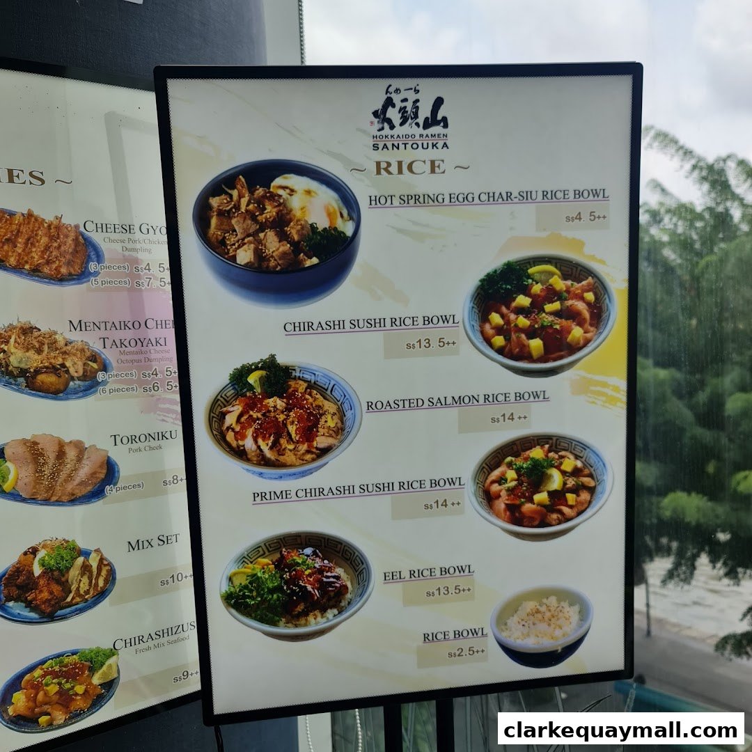 A menu board for Hokkaido Ramen Santouka featuring various rice bowls and other dishes.
