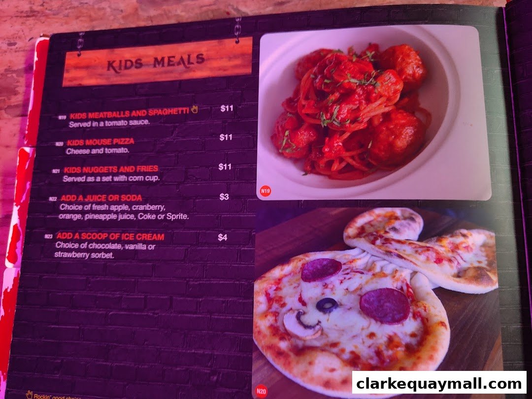 A menu page featuring kids' meals with images of spaghetti and meatballs, and a fun mouse-shaped pizza.