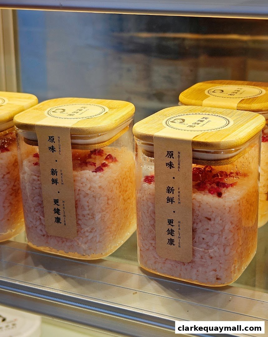 Jars of fermented rice with dried fruit, labeled 'Natural, Fresh, Healthier'.