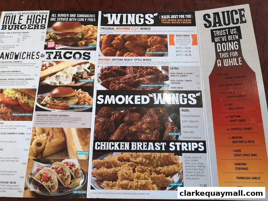 A menu from Hooters featuring burgers, sandwiches, tacos, wings, and sauces.