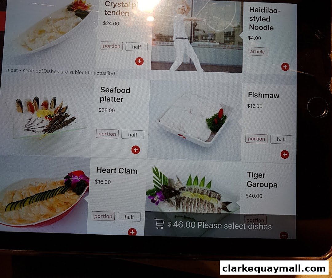 A digital menu displaying various hot pot ingredients and prices at Haidilao.
