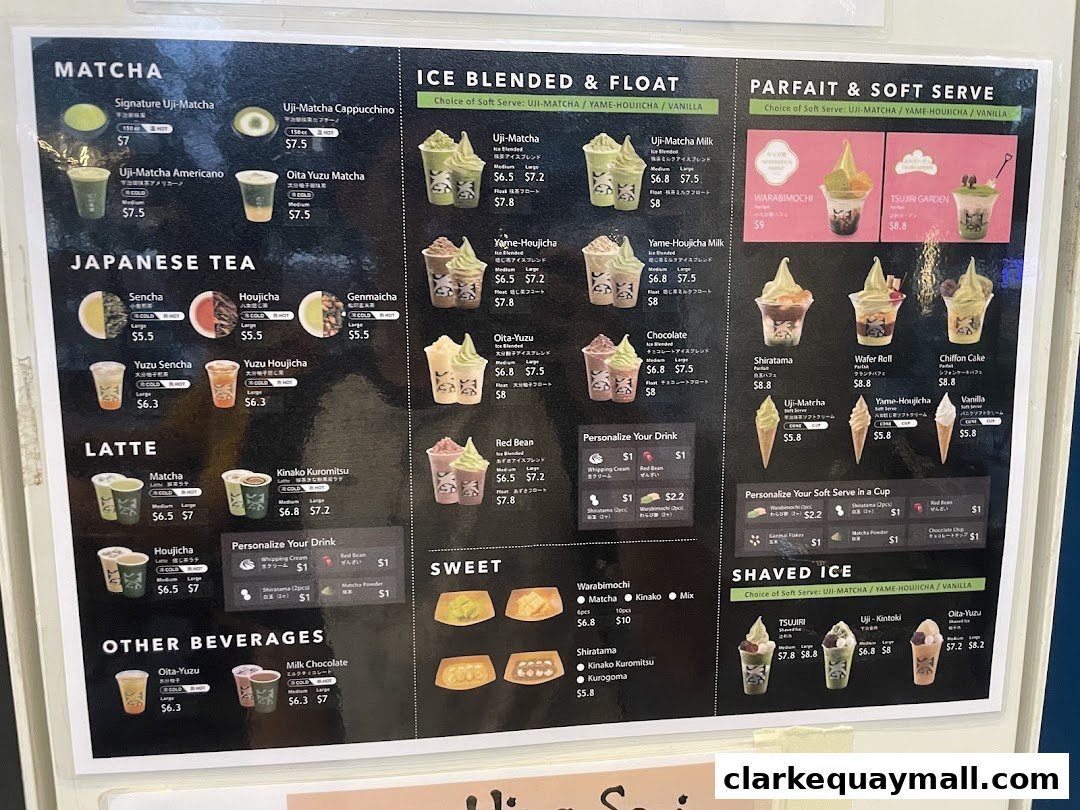 A menu board displaying various matcha, latte, ice blended, parfait, and shaved ice desserts and drinks.