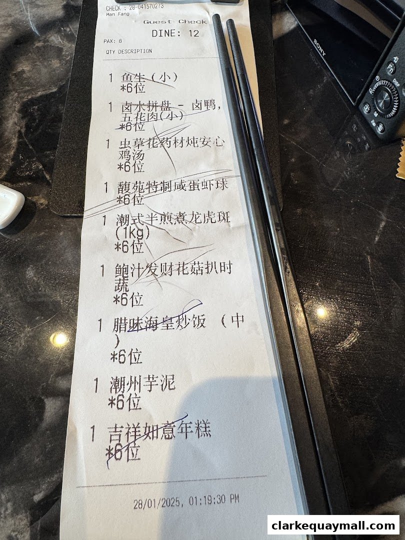 A close-up of a restaurant receipt listing various Teochew dishes and their quantities.