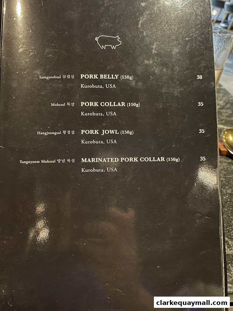 A menu from Hanjip Korean Grill House featuring various pork cuts with prices.