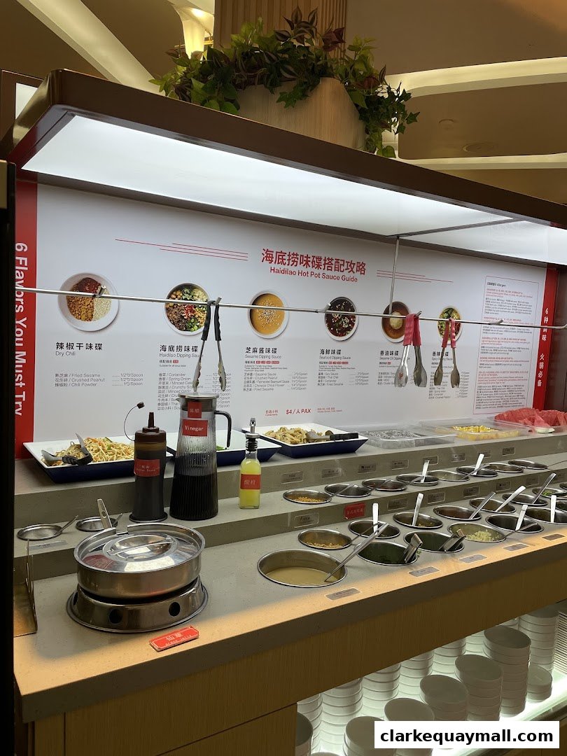 A Haidilao Hot Pot sauce bar with various ingredients and a guide for mixing flavors.