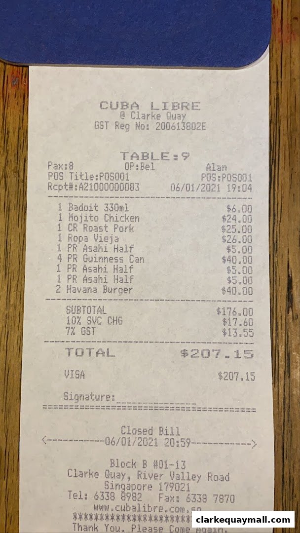 A receipt from Cuba Libre Cafe Bar showing a list of food and drinks ordered and the total bill.