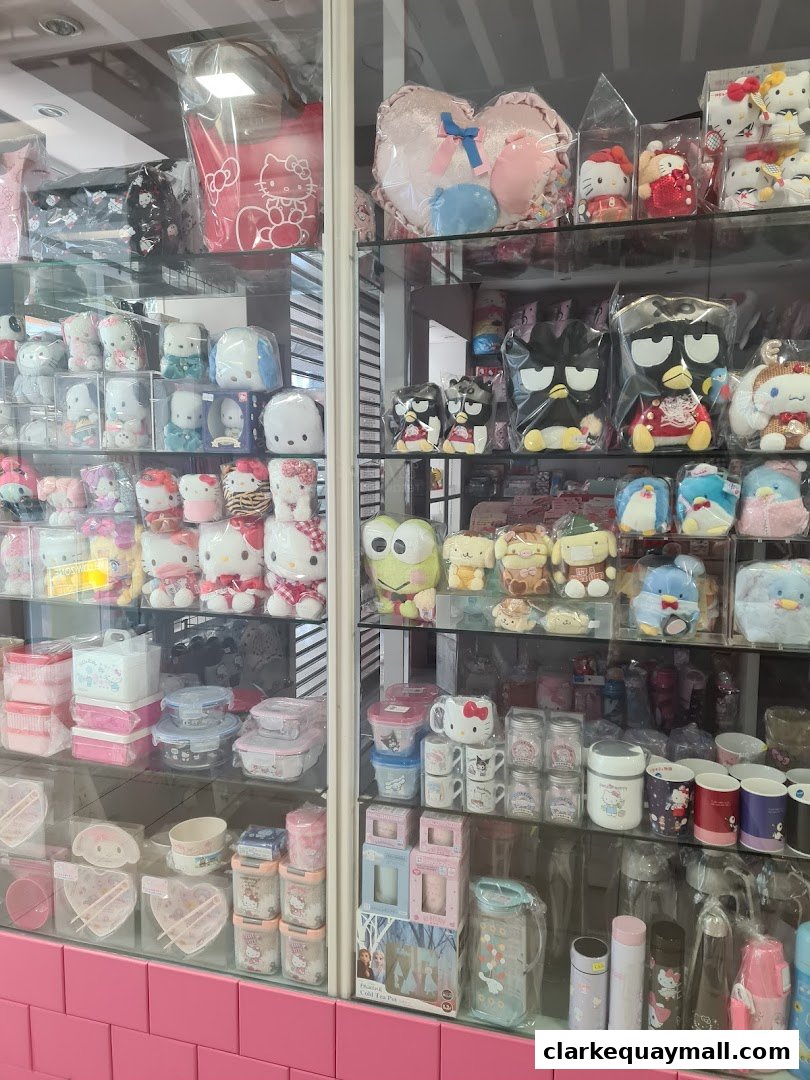 A display of cute character merchandise, including plush toys, storage containers, and mugs.