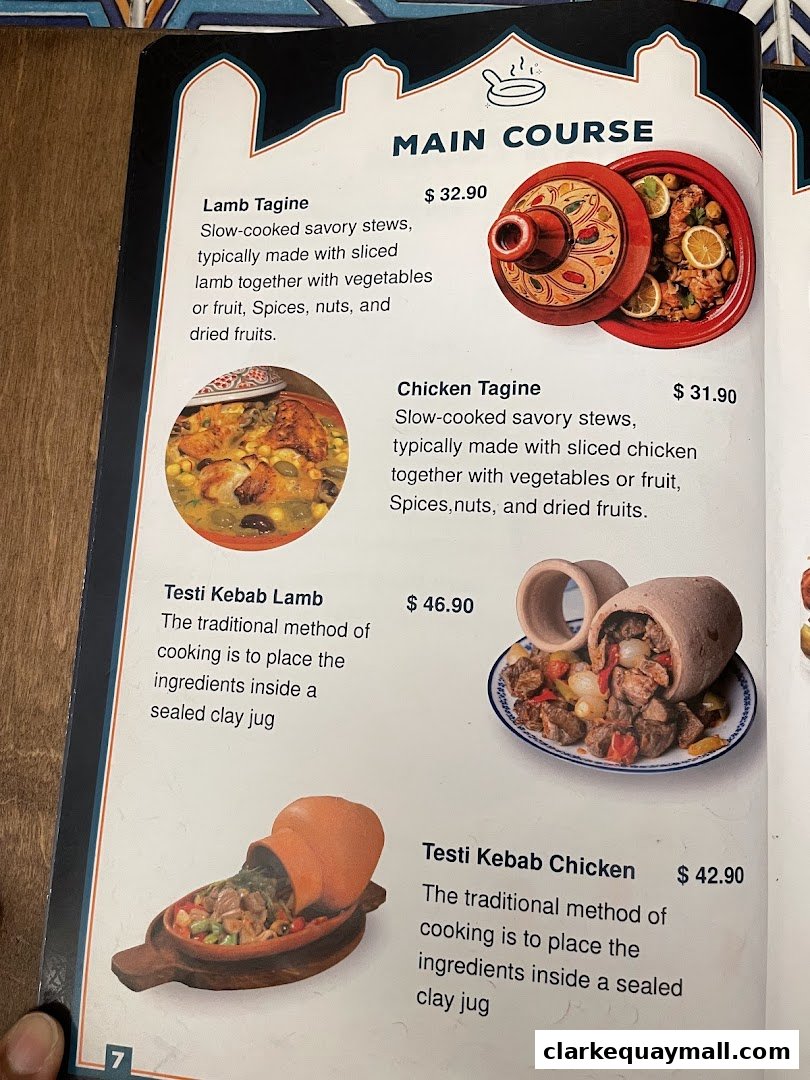 A menu page featuring main course dishes like Lamb Tagine and Testi Kebab.