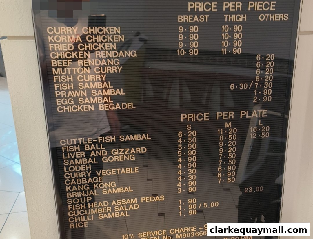 A menu board displaying prices for various chicken dishes and other food items.