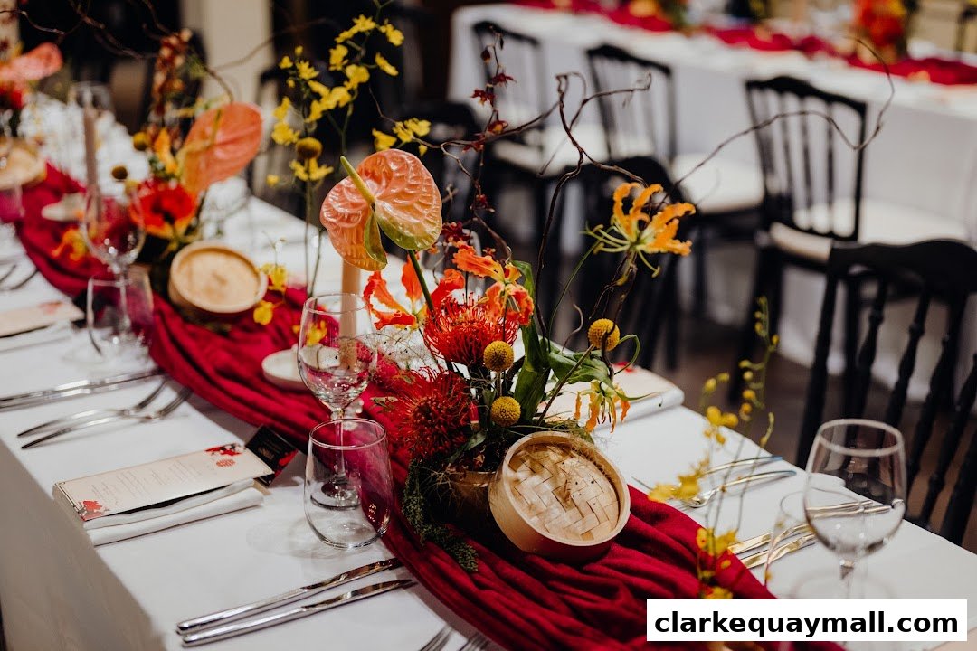 A beautifully set table with floral arrangements and place settings for a formal event.