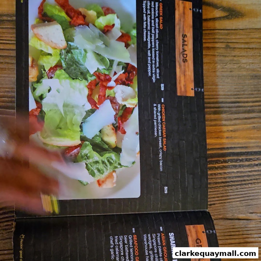 A menu page featuring salads and sharing platters with enticing descriptions and prices.