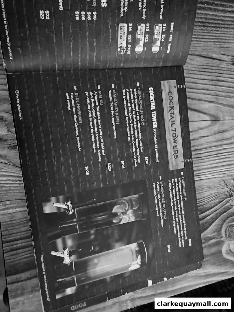 A menu featuring various cocktail towers with descriptions and prices.