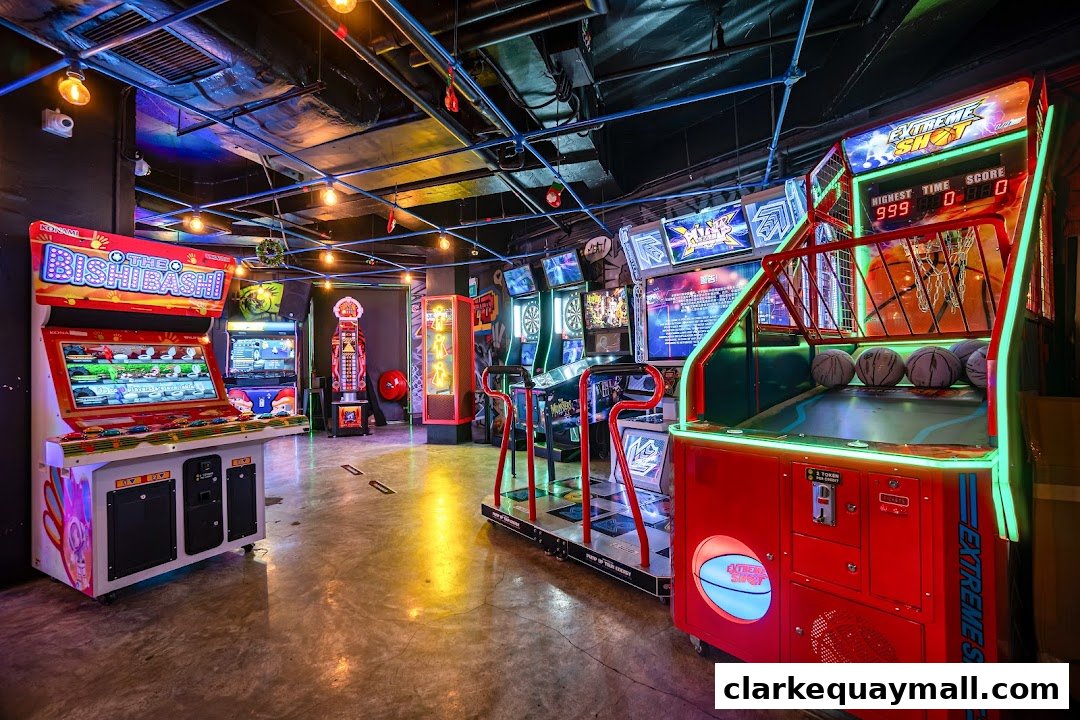 Interior view of an arcade bar with various game machines, including basketball and rhythm games.