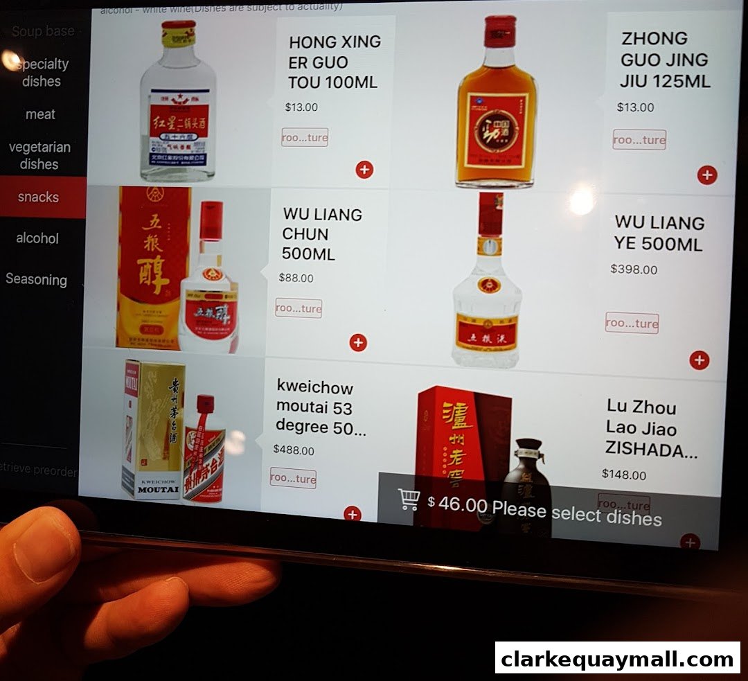A digital menu displaying various bottles of alcohol with prices and images.