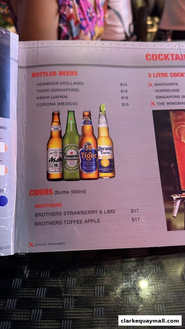 A menu page featuring bottled beers, ciders, and cocktails with prices.