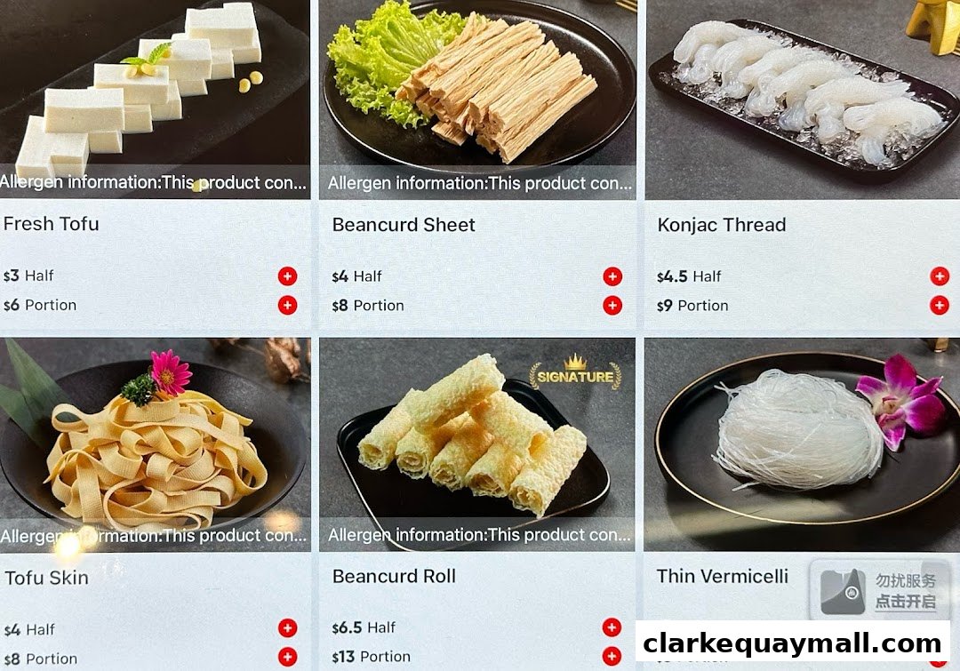 A grid of six dishes, showcasing ingredients for hot pot dining.
