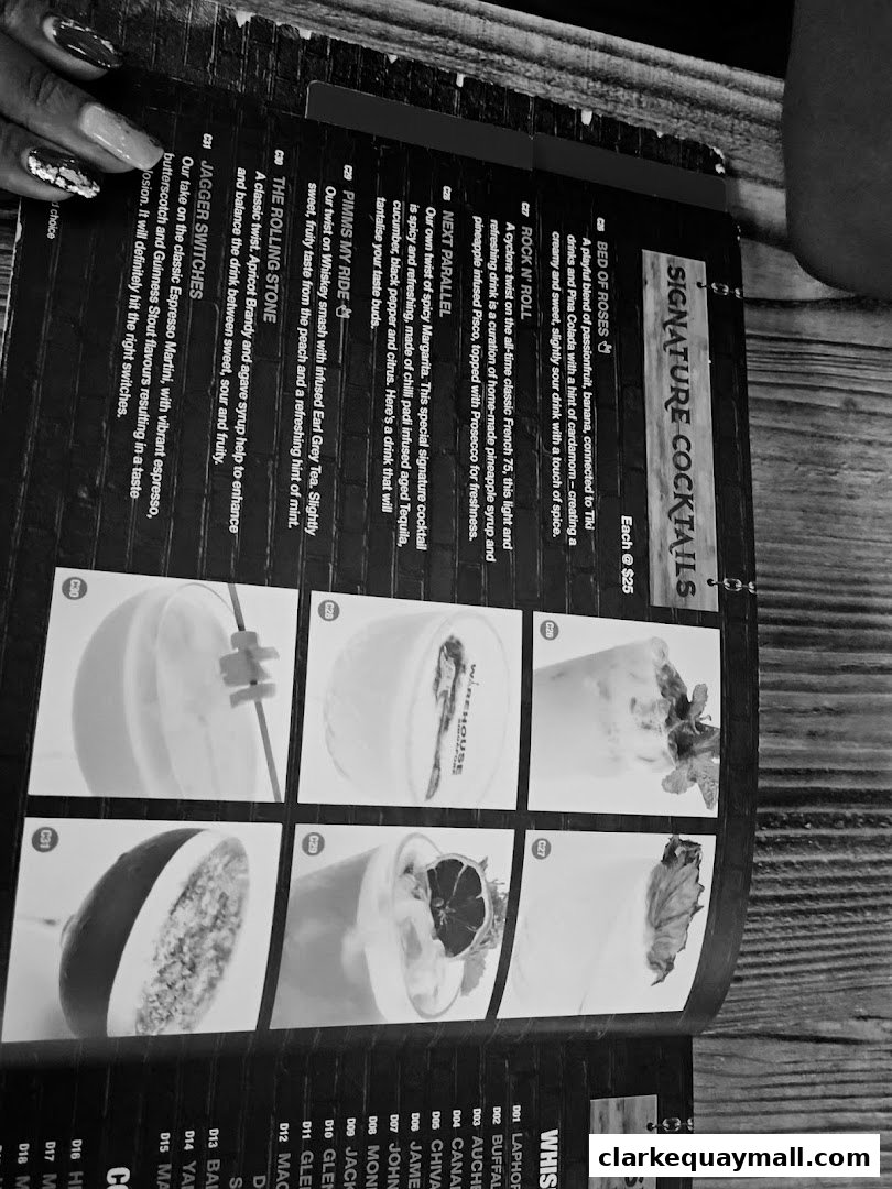 A menu page showcasing signature cocktails with enticing descriptions and images.