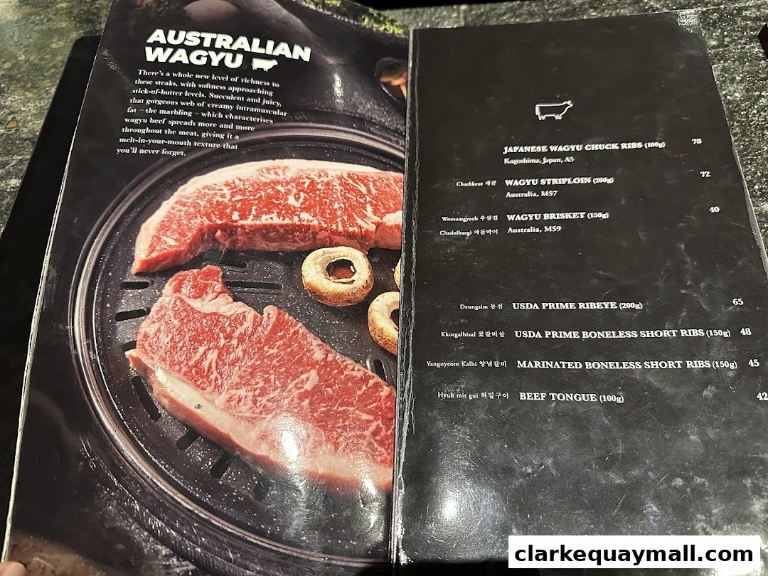 A menu featuring Australian Wagyu beef with descriptions and prices for various cuts.