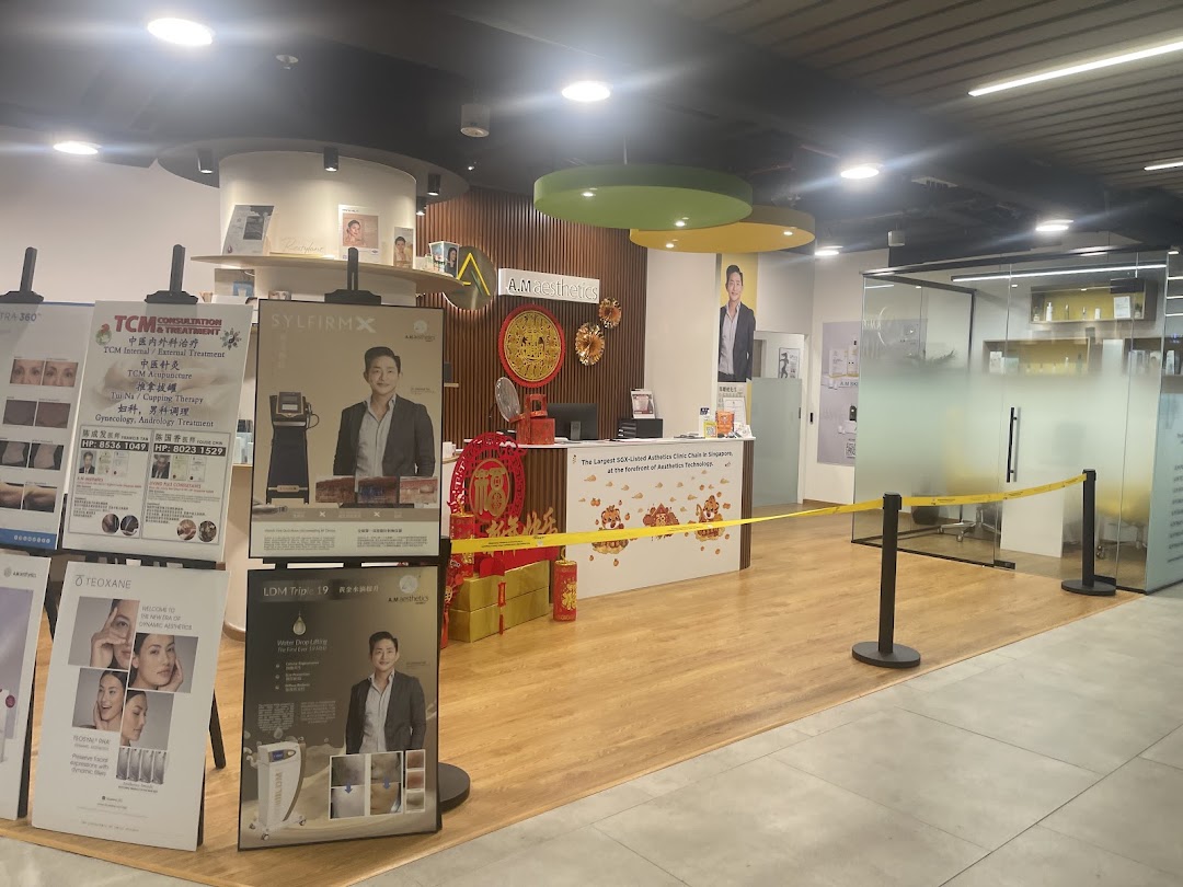 Interior view of A.M Aesthetics Clementi reception area with promotional displays and festive decorations.