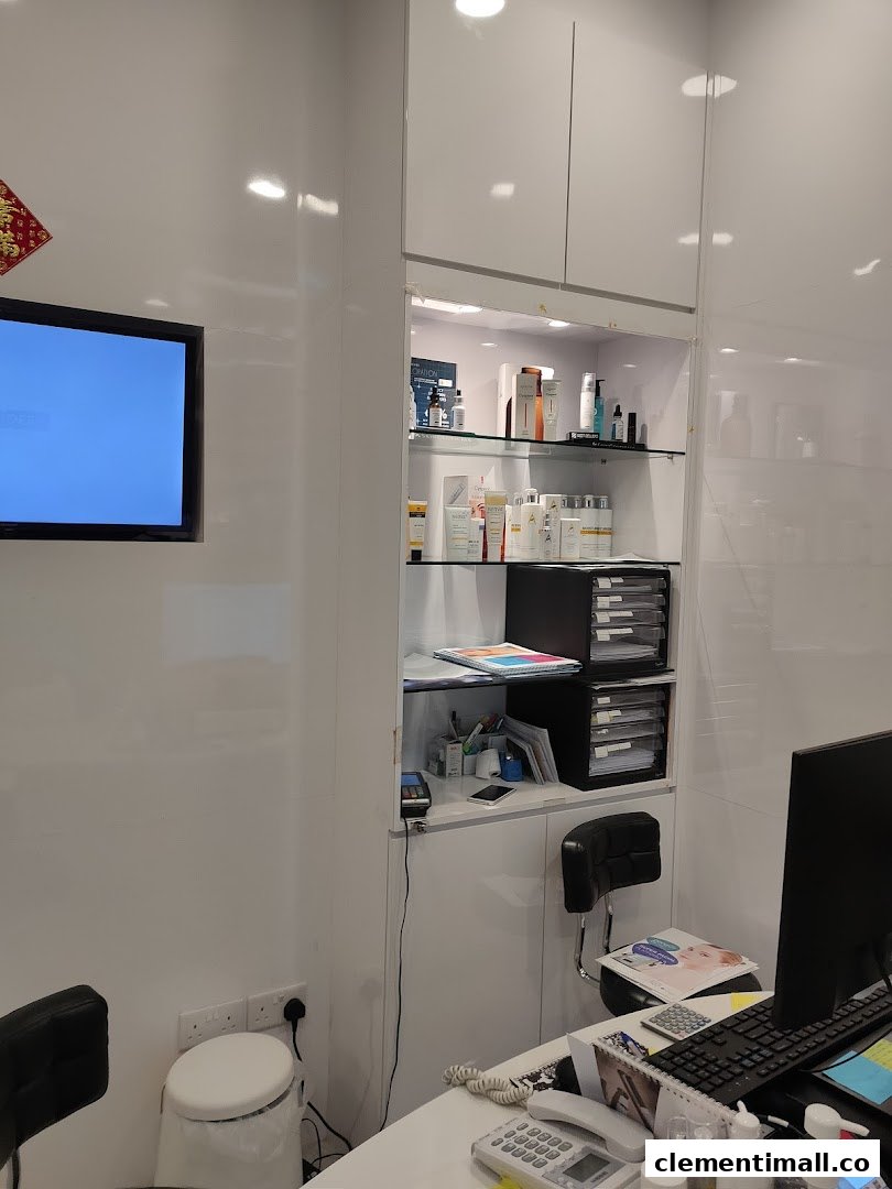 Interior view of A.M Aesthetics Clementi, showing a clean reception area with product displays and a desk.