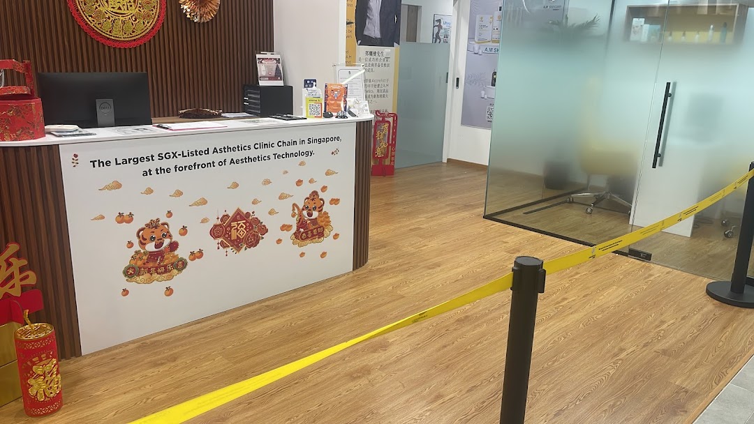 An interior view of A.M Aesthetics Clementi reception area with a counter and festive decorations.
