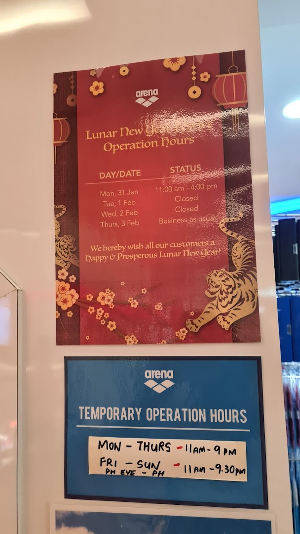 Signs displaying Arena's Lunar New Year and temporary operating hours.