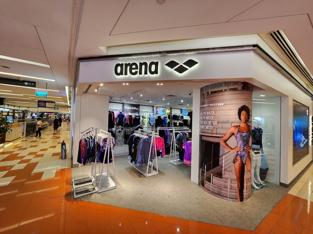 The Arena shopfront showcases a wide range of swimwear and aquatic sports apparel in a vibrant mall setting.