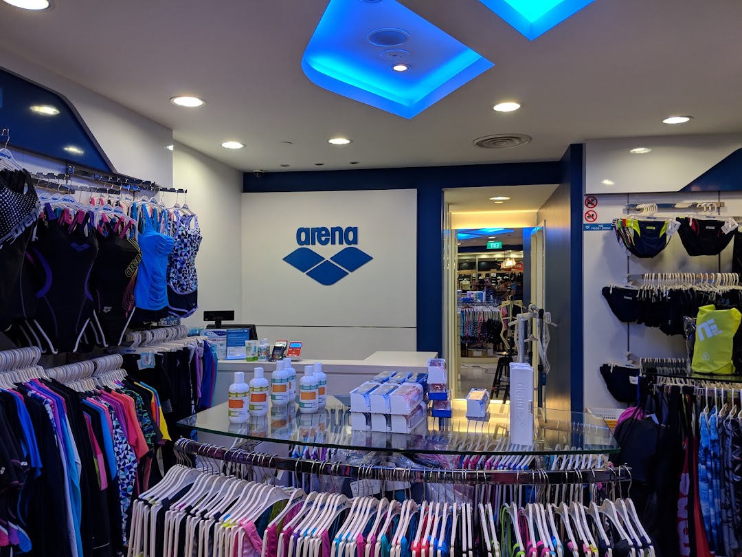 Interior view of the Arena store showcasing a wide range of swimwear and aquatic accessories.