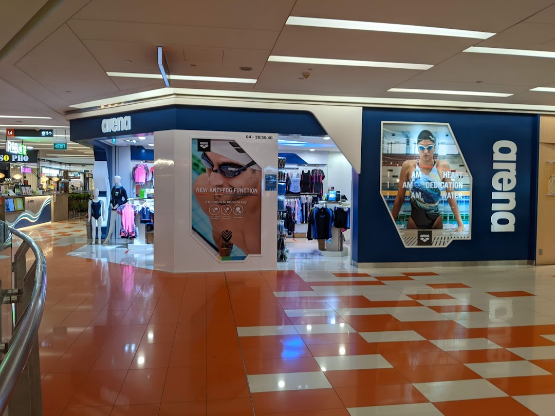 The Arena swimwear and sports apparel shop entrance with prominent displays and branding in a mall.