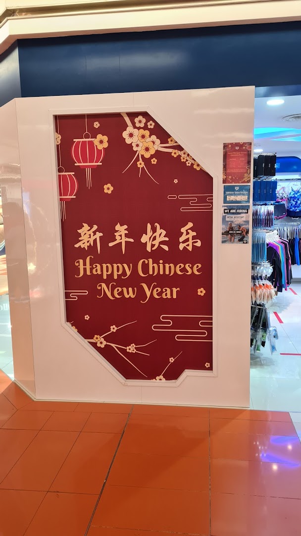The Arena shop entrance features festive Chinese New Year decorations and visible merchandise inside.