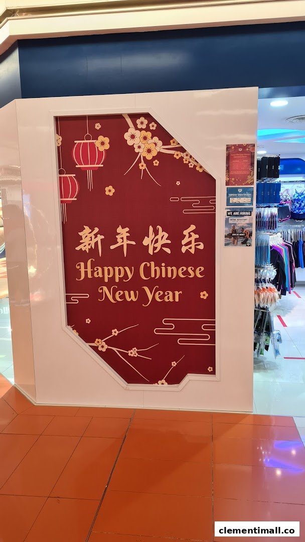 The Arena shop entrance features festive Chinese New Year decorations and visible merchandise inside.