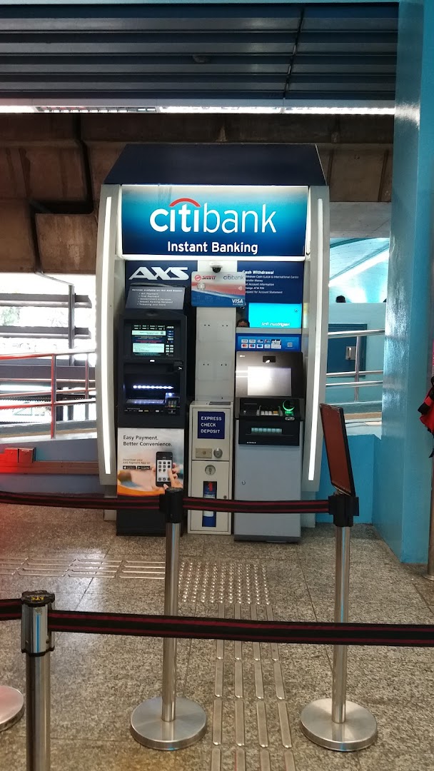 A Citibank Instant Banking kiosk with AXS services and an ATM, offering convenient financial transactions.